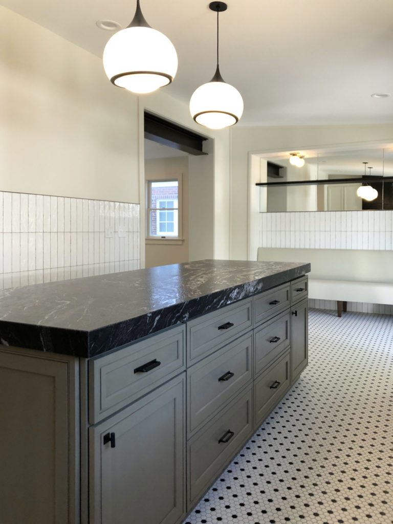 kitchen with white handmade look tile and mosaic tile