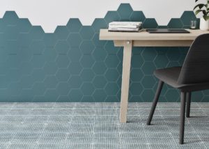 room wall with hexagon blue solid color tiles