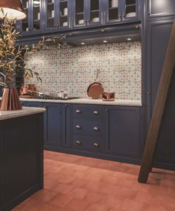 kitchen with red stone look porcelain tile