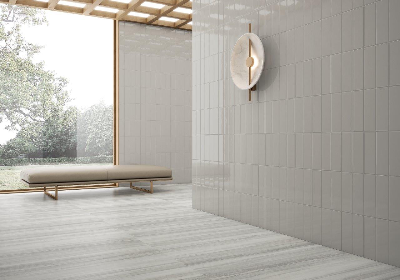 room with solid white textured ceramic tile 